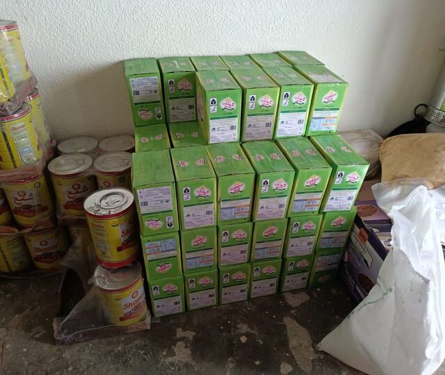 Cartons of supplies stacked for a distribution run