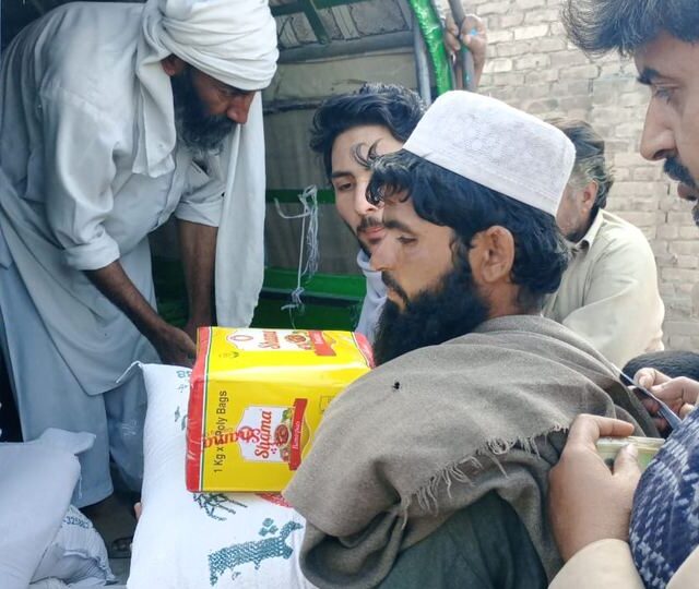 A household receives its ration pack