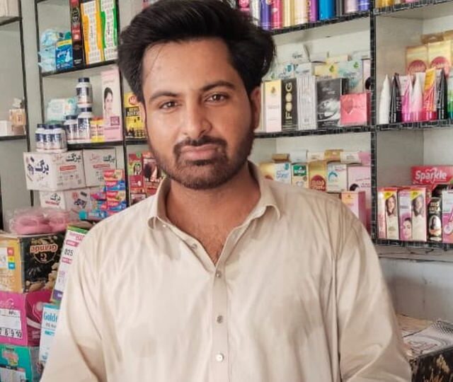 A shopkeeper at his counter